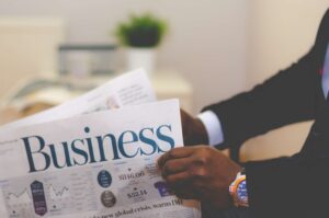 businessmen reading newspaper